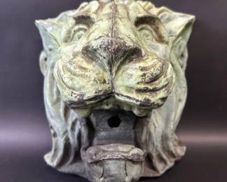 Marvelous aged copper gutter spout in the shape of a lion's head