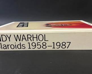 Large illustrated book entitled "Andy Warhol Polaroids 1958-1987"