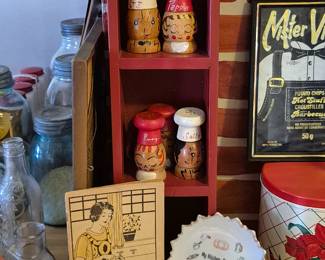 Vintage cookbooks and salt and pepper sets