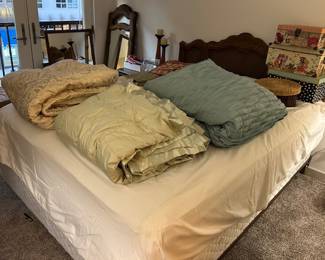 Queen-sized  bed frame and headboard [mattresses at no charge] — Coverlets and comforters — Wall-hung, wood-framed mirror — Wooden wall carving suitable for your home bar area