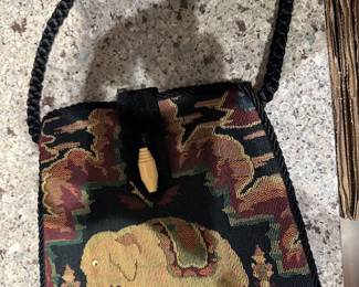 Front of fabric purse with elephant motifs.