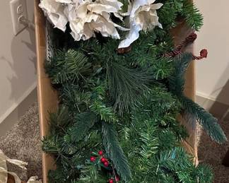 Assorted holley, evergreen, and flower decorative items
