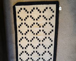 A48 - $40. Small Handwoven Rug. Measures 2'x3'