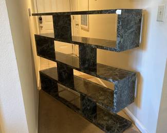 A35 - $125. 4 Level Shelving. Measures 60" wide x12" deep x 47" tall.