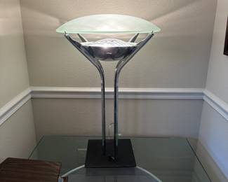 A25 - $40. Chrome Table Lamp with glass shade. Measures 28.5" tall.