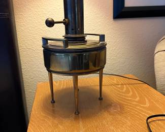 A33 - $30. Hollywood Regency Brass Lamp. Measures 35.5" tall. One leg needs tightened. (Shade is over a glass globe - shade needs replaced.)