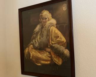 A26 - $30. Art Deco Framed Print. Lady in a Gold Coat. Frame is old and needs tightened. Measures 17.5" x 21.5" tall.