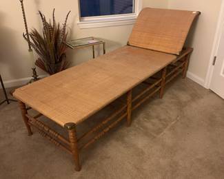 A58 - $225. Antique Rattan Chaise. Definitely needs some glue to tighten it up. Adjustable head rest. Rattan looks good overall but we have not weight tested it at all. Measures 25" wide x 71" long x 34" tall.