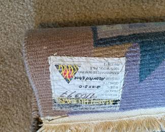 A41 - $40. Masterlooms 100% Wool Area Rug. Measures 2'x3'.