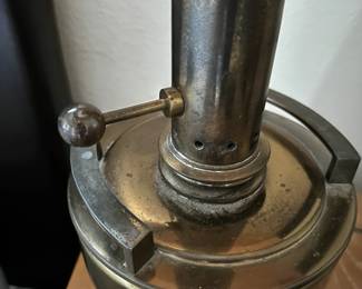 A33 - $30. Hollywood Regency Brass Lamp. Measures 35.5" tall. One leg needs tightened. (Shade is over a glass globe - shade needs replaced.)