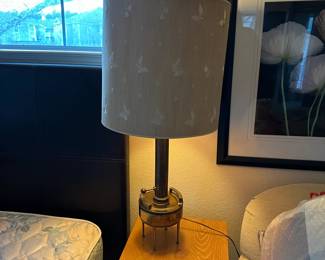 A33 - $30. Hollywood Regency Brass Lamp. Measures 35.5" tall. One leg needs tightened. (Shade is over a glass globe - shade needs replaced.)