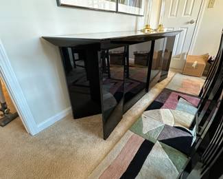 A14 - $225. High Gloss Side Board. Measures 76" wide x 24" deep x 32" tall.