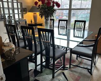 A3 - $200 MAKE ME AN OFFER. Chrome Sawhorse Base with LARGE Glass top. Glass measures 5' x 7'. You will need a couple STRONG people to move the glass out! Includes 6 regular chairs. 2 arm chairs.