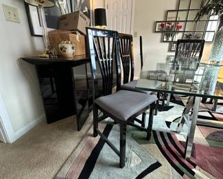 A3 - $200. Chrome Sawhorse Base with LARGE Glass top. Glass measures 5' x 7'. You will need a couple STRONG people to move the glass out! Includes 6 regular chairs. 2 arm chairs.