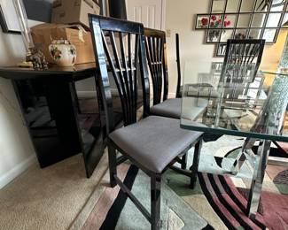 A3 - $200. Chrome Sawhorse Base with LARGE Glass top. Glass measures 5' x 7'. You will need a couple STRONG people to move the glass out! Includes 6 regular chairs. 2 arm chairs.