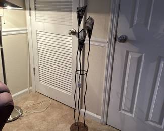 A52 - $35. Tea Candle Holder. Measures 48" tall. Base has some rust (unsure if that's how it came?)