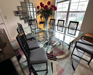 A3 - $200. Chrome Sawhorse Base with LARGE Glass top. Glass measures 5' x 7'. You will need a couple STRONG people to move the glass out! Includes 6 regular chairs. 2 arm chairs.