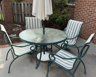 Green metal patio table and chairs