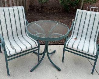 Green metal chairs and table