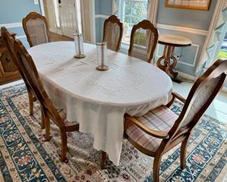 Bernhardt dining table with 6 rattan back chairs