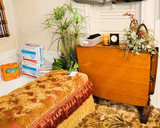 Large ottoman, Designer handbags and drop leaf table sitting on a really nice rug