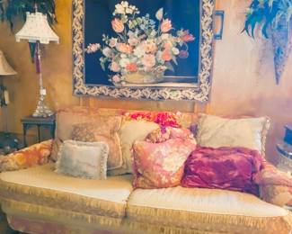 Custom down filled sofa with pillow back.  Wall floral displays and tapestry