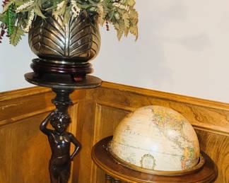 Unique wood carved plant pedestal, floral arrangement and standing globe
