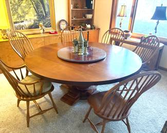 Solid wood 6' round pedestal dining table with lazy susan, and 6 Windsor dining chairs