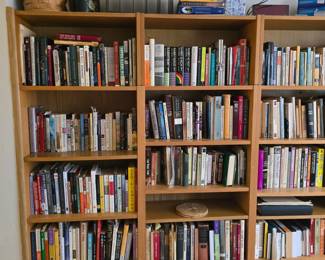 Bookcase is built in and not for sale, books are $2 each, $5 for coffee table books, unless marked. 