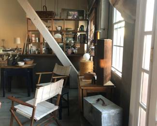 Taxidermy, metal and wooden boxes, folding chairs with euro linen.