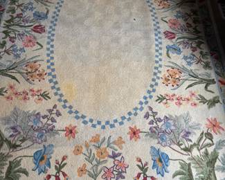 Delightful signed floral rug