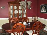 Dining room has two leaves, six chairs, two of which are armchairs and the china hutch.