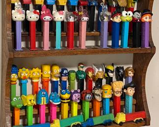 Numerous Pez Dispensers (All Have Feet/Small Amount of Putty on Feet to Hold in Place/Peels Off)