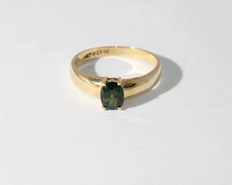 14kt yelow gold Green Stone Ring featuring a soltaire oval prong set Green stone that test between a spinel and a sapphire, pretty stone, 2.6 grams total weight, size 8.25