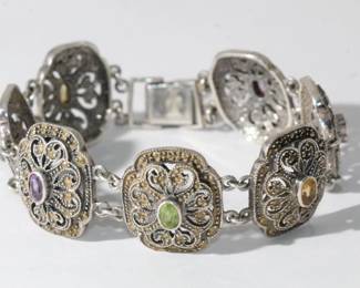 .925 Sterling Silver & Multi Gemstone Bracelet featuring 7 medallions each with bezel set gem to include citrine, aqua-marine, amethyst and blue topaz, each accented with marcasite, approx 7.5" in length and each medallion approx 1" wide, 41.1 grams to