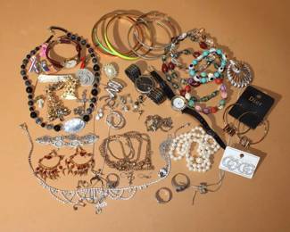 Large lot of Jewelry to include Sterling over 30 grams, gold filled, as well as designer pieces by Trifari, Dior, GG Earrings, Watches, Pendants, Bracelets, Necklaces