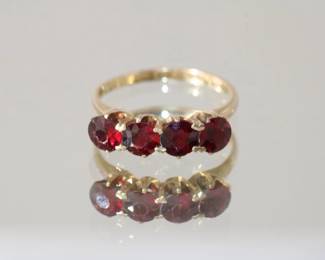 14kt yellow gold Garnet Ring featuring 4 round prong set garnets approx 1ctw, 2.45 grams total weight, size 5.75