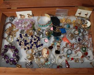 Large group of Costume Jewelry with display case includes 14kt HGE, Sterling, gold filled; rings necklaces, earrings, cuff links, cas is wood w/ plexiglass top