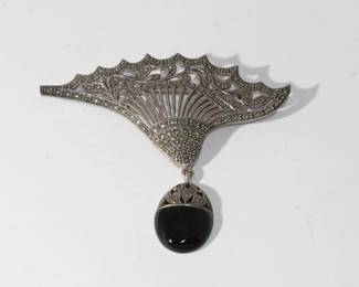 .925 Sterling Silver Vintage Brooch with black onyx and accented through out with marcasite, measures approx 3" long and 3" wide, 18.8 grams total weight