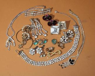Large lot of mainly Rhinestone Jewelry to include earrings, necklaces, hair barrets, one  pair of earrings marked .925 sterling, one marked K.J.L. one pair of cuff links, heart pendant, approx 15 total items