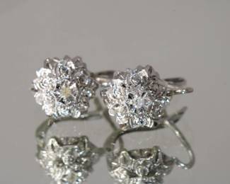14kt white gold Diamond Pierced Earrings with locking clip back, each earring has a central round diamond approx 0.20 ctw for both done in floral motif, 5.3 grams total weight