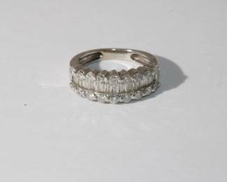 14kt white gold Diamond Ring with a central row of baguette diamond set between two rows of round cut diamonds approx 2ctw for all diamonds, 4.3 grams total weight, size 4