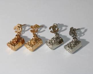2 Pair of Designer Earrings by Chanel; 1 - gold colored purses, 2 - silver colored purses each are pierced post style and appear to be new