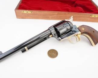 Make: Colt
Model: SAA 125th ANNIV.
Caliber: .45 COLT
Action: SA
Barrel: 8
Bore: Bright
Serial # 5862A
Condition: Excellent
Crafted in 1998 for Colt's 125th anniversary, this commemorative Colt SAA .45 Colt embodies classic Western craftsmanship and precision engineering. Its robust frame, refined finish, and authentic design evoke the legendary revolver that shaped American frontier history and captivated film audiences. Housed in an exclusive display box, this collectible pays homage to Colt’s storied legacy and enduring cultural impact on the iconic Wild West. Please see photos.