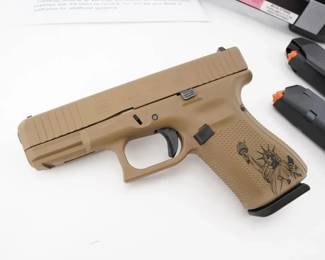 Make: Glock
Model: 19 Gen 5
Caliber: 9x19
Action: Semi
Barrel: 4
Bore: Shiny
Serial # AHFM404
Condition: Very Good
This Apollo Custom Glock 19 Gen 5 features a Patriot Brown and Barrett Brown Cerakote finish, applied by Apollo Custom Inc., a certified Cerakote applicator. The Gen 5 model includes over 20 design modifications from its Gen 4 predecessor, such as the Glock Marksman Barrel, an nDLC finish, and an ambidextrous slide stop. It comes with three magazines. Please see photos.