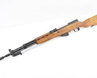 Make: Yugo
Model: 59/66
Caliber: 7.62X39
Action: Semi
Barrel: 25
Bore: Bright
Serial # 302829
Condition: very Good
Importer: NVI
The Yugo NVI 59/66 7.62x39, produced from 1967 to the late 1980s, is a variant of the Soviet-designed SKS rifle. Manufactured by the Zastava Arms Factory in Yugoslavia, it features a distinctive grenade launcher attachment and a gas shutoff valve for launching rifle grenades. Used by Yugoslav and later Serbian forces, it saw action in various conflicts, including the Yugoslav Wars. Known for its rugged design, it remains a highly collectible piece of military history. Comes with a bayonet. Please see photos.