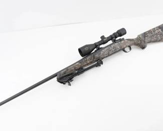 Make: Ruger
Model: M77 Mark II
Caliber: 7mm Rem Mag
Action: Bolt
Barrel: 24
Bore: Bright
Serial # 791-40380
Condition: Very Good
This Ruger M77 Mark II in 7mm Rem Mag, featuring a precision bolt-action system enhanced by a stable bi-pod, distinctive camo stock, and a rugged all-weather finish, was produced in 2007. Renowned for its reliability and accuracy, it has proven its worth in competitive shooting events and traditional big-game hunts, embodying a legacy of American craftsmanship and field-tested performance in demanding outdoor conditions. Please see photos.
