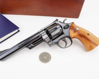 Make: Smith & Wesson
Model: 25-3 125 ANNV.
Caliber: .45 Cal
Action: DA
Barrel: 8
Bore: Bright
Serial # 7093
Condition: Excellent
This limited edition commemorative Smith & Wesson firearm, celebrating the company’s 125th anniversary, is a meticulously crafted .45 caliber masterpiece produced in 1977. Its precision engineering, distinctive engraving, and custom display box underscore its collectible allure and enduring performance. Revered by collectors and historically featured in law enforcement heritage exhibitions, this piece exemplifies American craftsmanship and operational excellence, embodying a proud legacy of service and innovation. Please see photos.