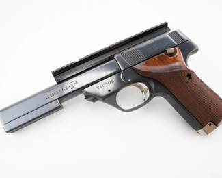 Make: High Standard
Model: Victor
Caliber: .22 LR
Action: Semi
Barrel: 5.5
Bore: Shiny
Serial # ML58611
Condition: Very Good
Manufactured in the early 1970s, this High Standard Victor .22 features a distinctive top rail for accessory attachments and exemplifies precision target shooting design. Its reliable, crisp trigger and ergonomic grip made it a favored tool in local and national marksmanship competitions, highlighting mid-century American firearm innovation. Although it comes without its magazine, its heritage in competitive sport and recreational shooting renders it a collectible piece steeped in cultural significance. Please see photos.