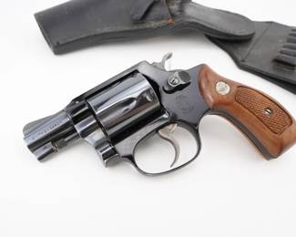 Make: Smith & Wesson
Model: 37 Airweight
Caliber: .38 SPL
Action: DA
Barrel: 2
Bore: Shiny
Serial # J828963
Condition: Very Good
An authentic Smith & Wesson Airweight .38 SPL, expertly crafted with a lightweight alloy frame for ease of carry and rapid response, this revolver features crisp trigger action and dependable double-action performance. Its production in the mid-1960s is confirmed through serial analysis, linking it to a legacy of law enforcement service and cultural impact in personal defense. Supplied with its original holster, this piece remains a collectible testament to American firearm innovation. Please see photos.